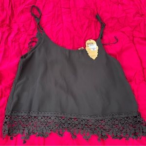 Beautiful summer top. New with tags. 100% polyester. Spaghetti straps.